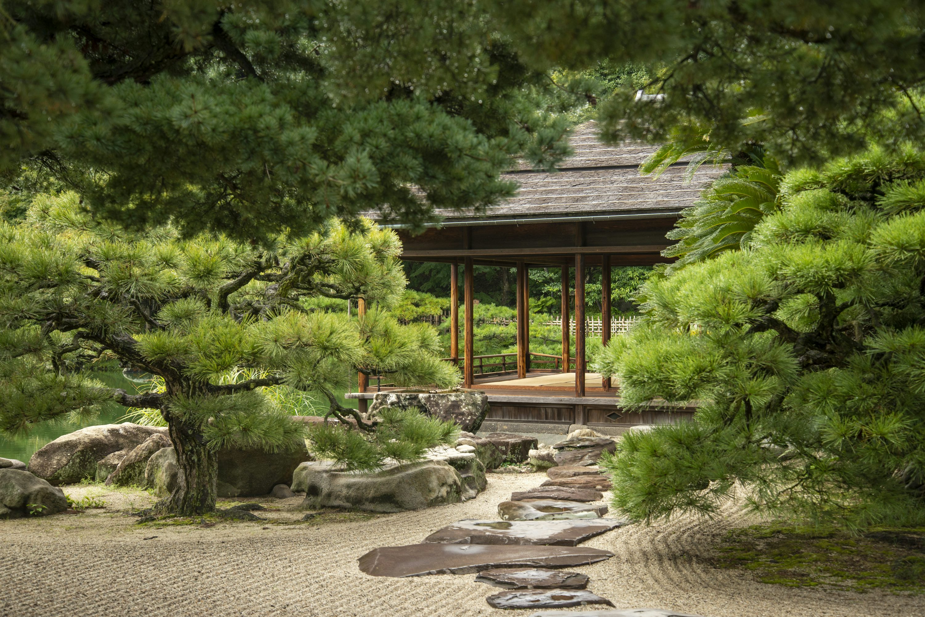 Traditional pavilion and pine trees in Ritsurin Garden, Japan
